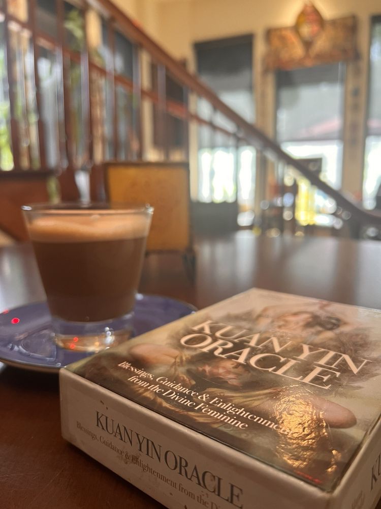 Espresso with spiritual book in the sunlit lounge