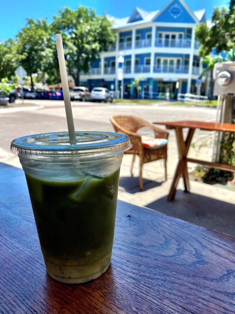 Iced matcha on outdoor table in the Gulfport sunshine