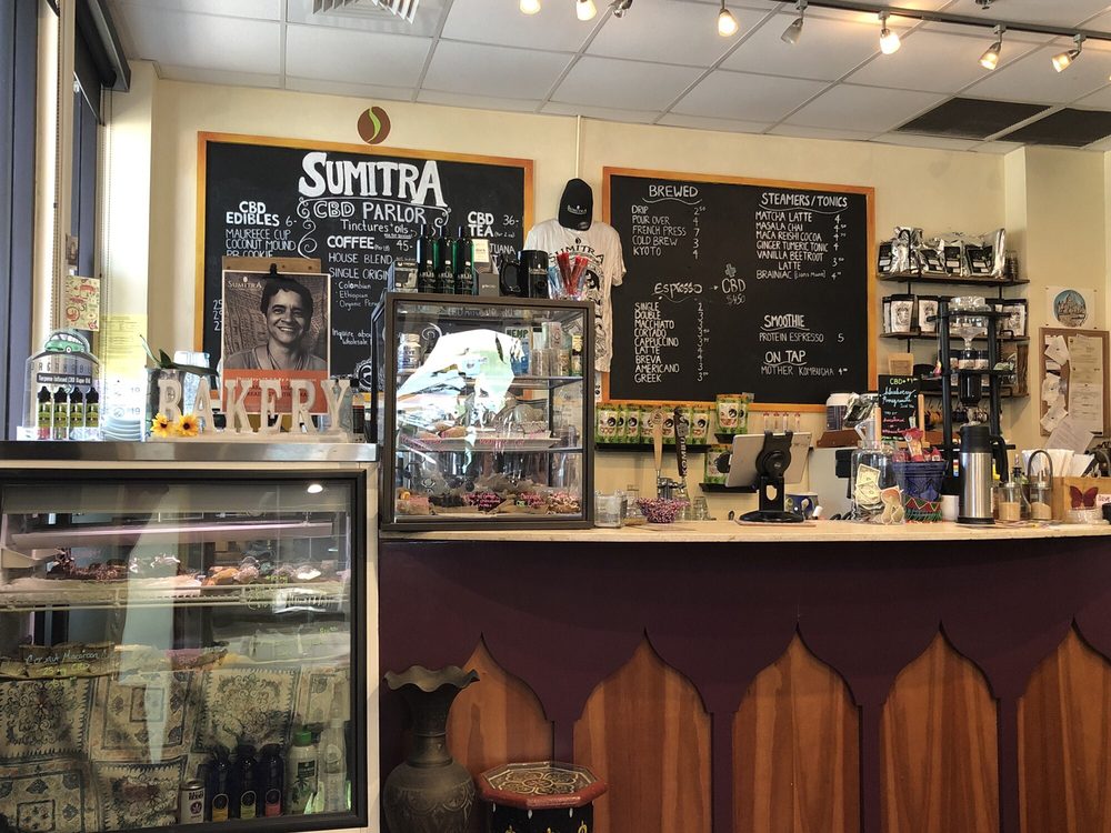 Counter area with chalkboard menu and bakery display case