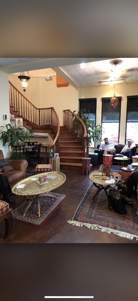 Grand interior with spiral staircase and Persian rugs