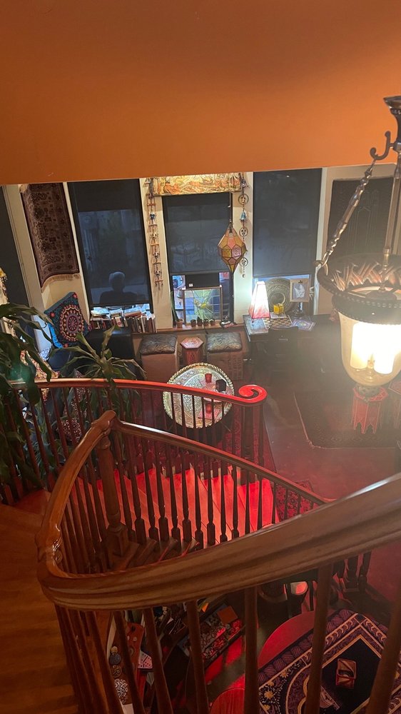 View from upstairs balcony showing Moroccan lanterns and lounge below