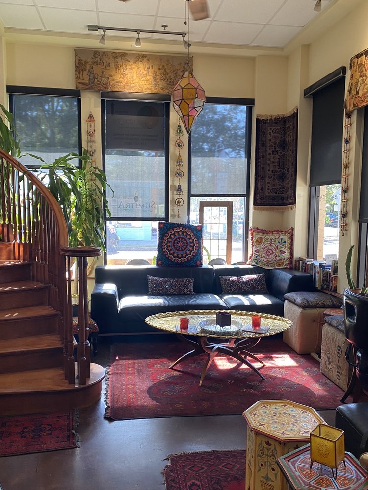 SumitrA lounge seating area with Persian rugs and Moroccan lanterns