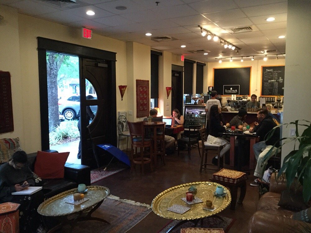 Wide view of SumitrA interior with customers enjoying the space